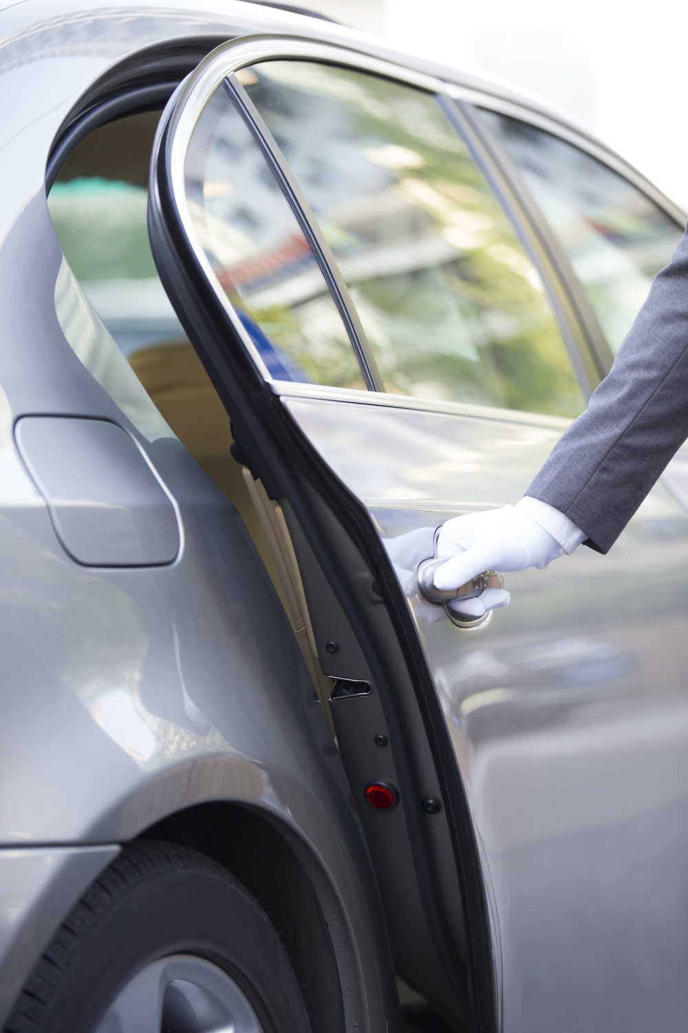 Chauffeur opening car door